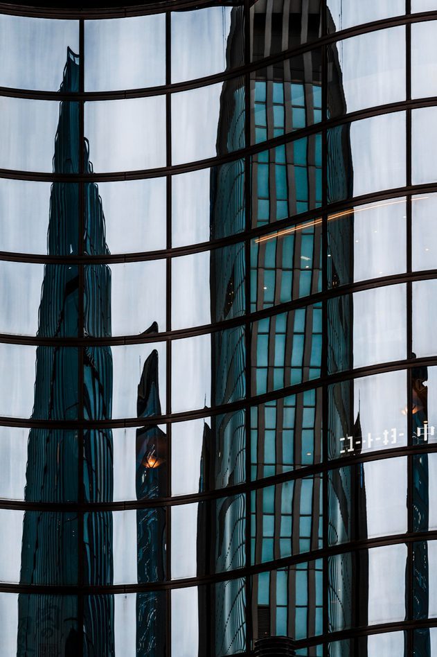 Tall office building with reflective tinted windows by Pensacola Window Tinting